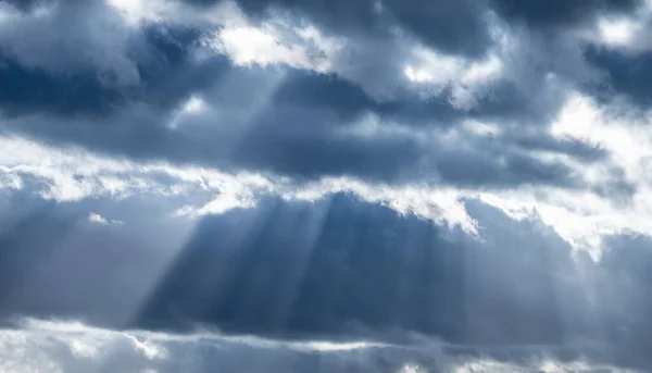 Divine sky scene. Dramatic cloudscape with sun beams.