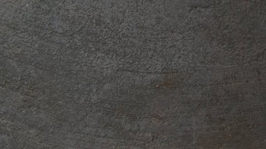 Kalıplı gri beton arka plan. Eski duvar ya da zemin koyu gri çimentodan yapılmış. Ezilmiş ve çatlamış. Uzayı kopyala Öznitelik.