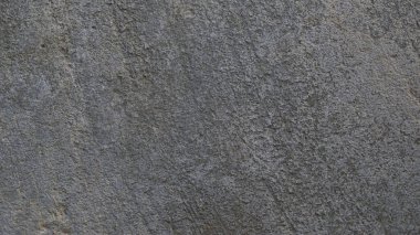Kalıplı gri beton arka plan. Eski duvar ya da zemin koyu gri çimentodan yapılmış. Ezilmiş ve çatlamış. Uzayı kopyala Öznitelik.