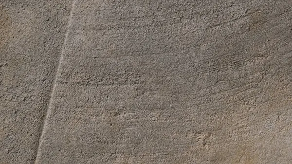Kalıplı gri beton arka plan. Eski duvar ya da zemin koyu gri çimentodan yapılmış. Ezilmiş ve çatlamış. Uzayı kopyala Öznitelik.