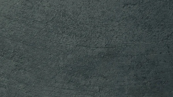 Kalıplı gri beton arka plan. Eski duvar ya da zemin koyu gri çimentodan yapılmış. Ezilmiş ve çatlamış. Uzayı kopyala Öznitelik.
