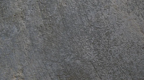 Kalıplı gri beton arka plan. Eski duvar ya da zemin koyu gri çimentodan yapılmış. Ezilmiş ve çatlamış. Uzayı kopyala Öznitelik.