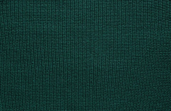 带花纹的光滑针织深绿色毛衣的质地 手工针织羊毛或棉织物的质地 针织或针织大边针织图案的背景 — 图库照片