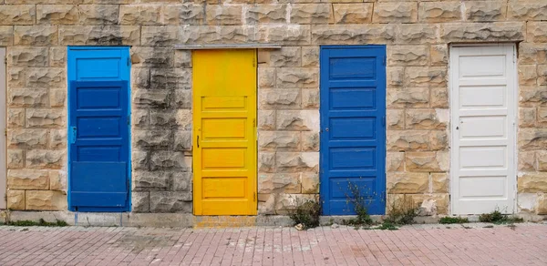 Traditional vintage painted wooden door in Malta. Popular travel destination. Entrance to house. Exterior of typical houses on the Mediterranean island of Malta.