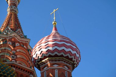 Ancient and medieval golden Domes with golden crosses on the Orthodox Church against the blue sky with copy space. Byzantine style. Banner, postcard or poster of a religious theme.