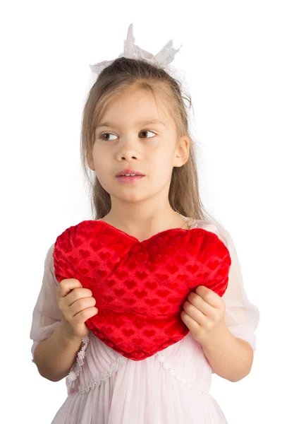 Girlwith travesseiro em forma de coração — Fotografia de Stock