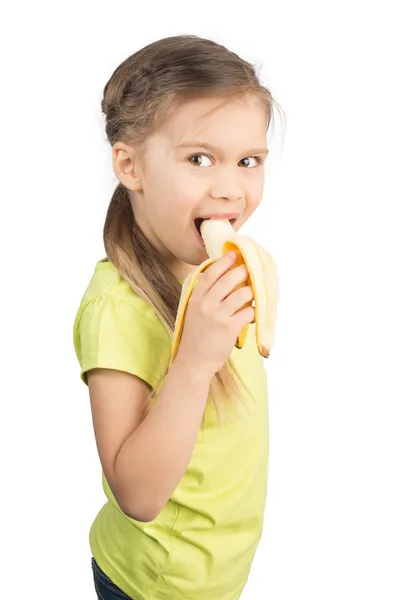 Jong meisje eten banaan — Stockfoto