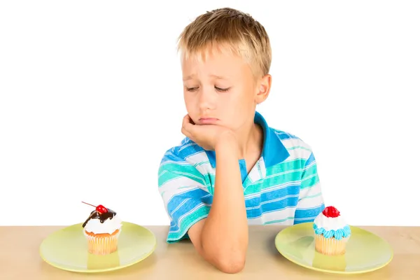 Bored Boy And Two Cupcakes — Stock Photo, Image