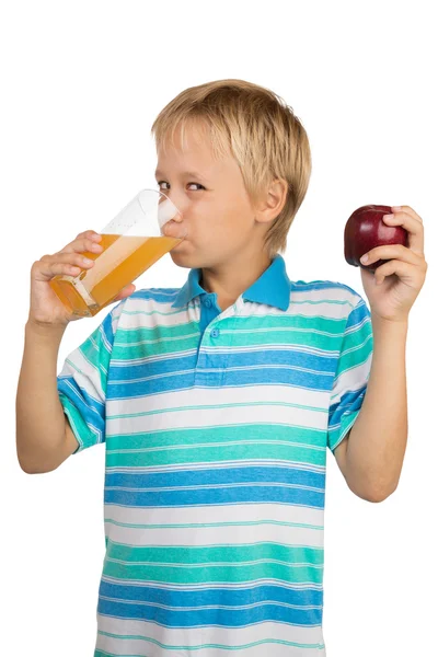 Boy Holds a Glass with an Apple Juice with One Hand and Apple i — Stock Photo, Image