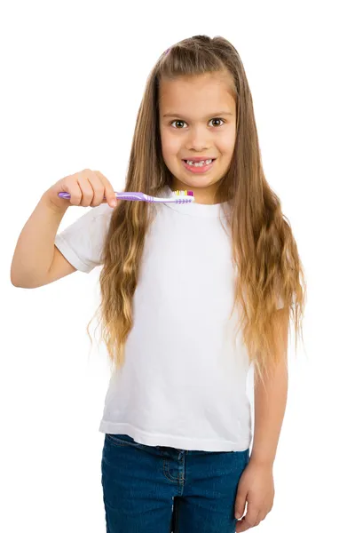 Chica con cepillo de dientes —  Fotos de Stock