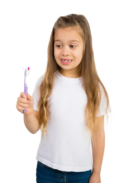 Chica con cepillo de dientes —  Fotos de Stock