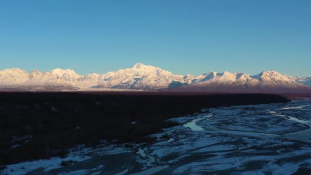 Mount Denali and Chulitna River in Winter at Sunrise. Alaska, USA. Aerial View