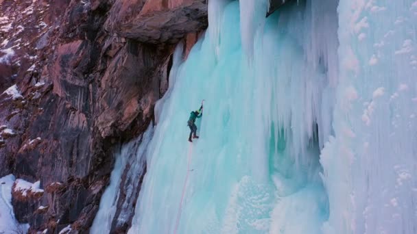 Mountaineer Man Leading Ice Ice Climbing Frozen Waterfall Aerial View — Stock video