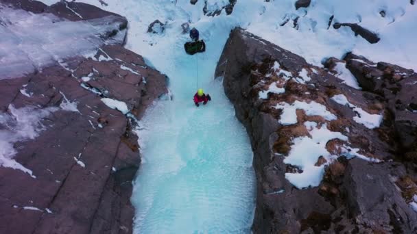 Ice Climbing Frozen Waterfall Mountaineer Woman Leading Ice Aerial Top — Stock video