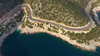 Car on Road along Coastline. Aerial Vertical Top-Down View. Turkey. Drone Flies Sideways