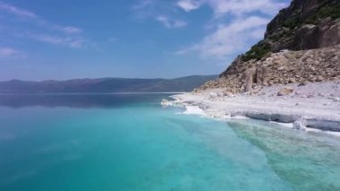 Lake Salda Coastline on Sunny Day. Crater Lake. Burdur Province, Turkey. Aerial View. Turkish Maldives. Drone Flies Forward at Low Level