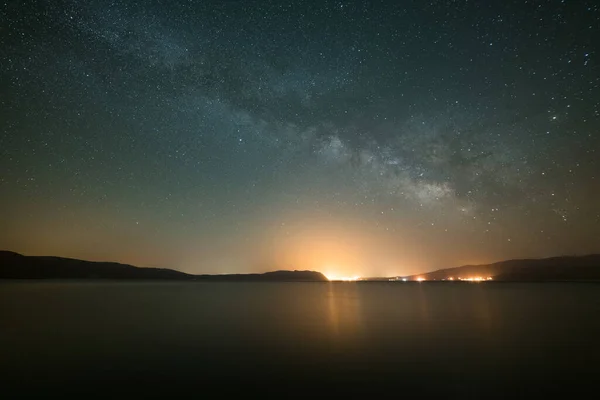Milky Way Core over Salda Lake at Night. Starry Sky and Light Pollution. Burdur Province, Turkey.