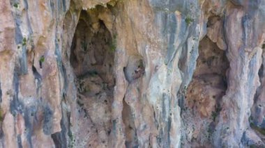 Man Climber Rock Climbing. Cliffs of Geyikbayiri, Antalya, Turkey. Aerial View. Drone Flies Backwards and Upwards