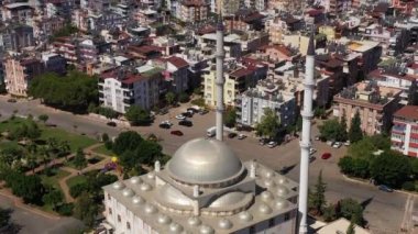 White Mosque, Cityscape and Mountains. Antalya, Turkey. Aerial View. Drone Flies Downwards, Tilt Up. Crane Shot