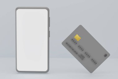 Gri arka planda sahte akıllı telefon ve banka kredi kartı