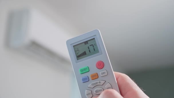 Hand Adjusting Temperature Air Conditioner Remote Control Working Air Conditioner — Stockvideo