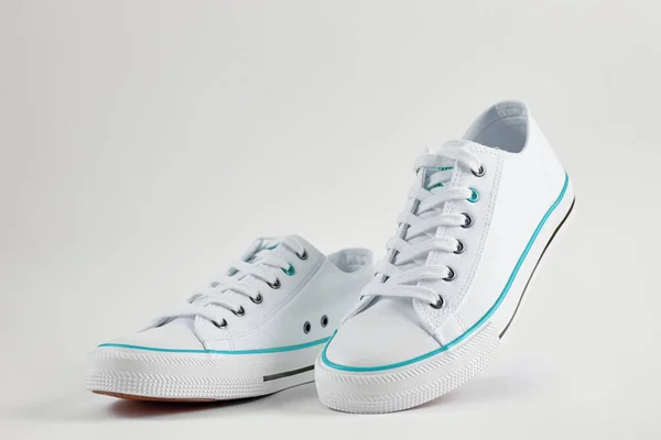 Casual sneakers on white background, creative minimalism — 스톡 사진