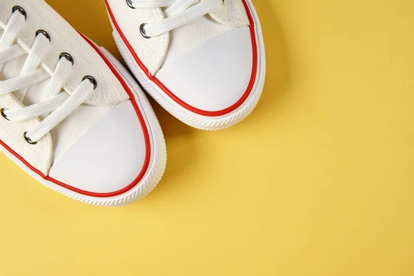 Female Sport Sneakers Yellow Background Casual Trendy Shoes Closeup Creative — Stockfoto