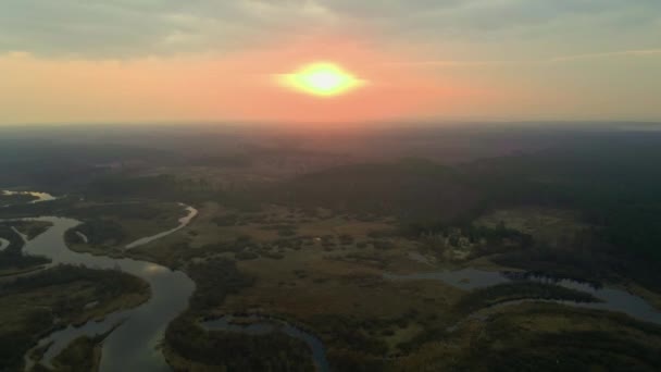 Aerial view of curved river with dramatic sunrise sky — Stock Video