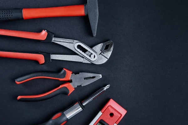 Set of tools for repair and maintenance on black background