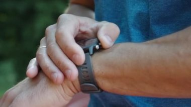 Man use fitness watch before cardio exercises, Checking results on smart watch after training, Healthy lifestyle concept