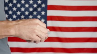 Male hands counting 100 usd banknotes agains american flag, Unrecognizable man calculating cash dollars