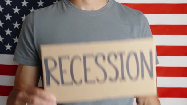 Usa Economic Crisis Recession Inflation Man Shows Paper Sheet Word — стоковое видео