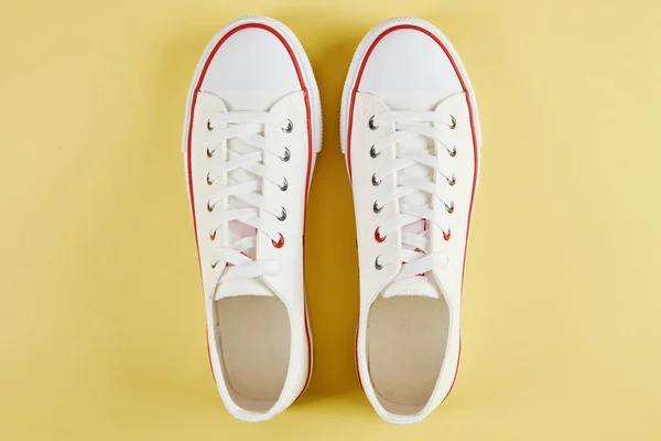Female Sport Sneakers Yellow Background Casual Trendy Shoes Closeup Creative — 스톡 사진