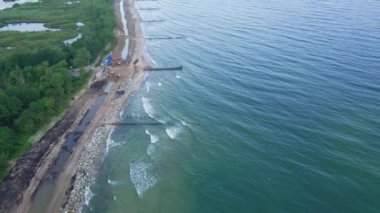 Aerial view of beautiful sea with waves and splashes,Baltic sea coast with sand beach, Sea landscape