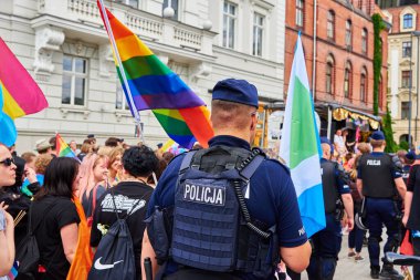 Police guarding demonstrators with rainbow flags for supporting LGBT community. Wroclaw, Poland - June 11, 2022