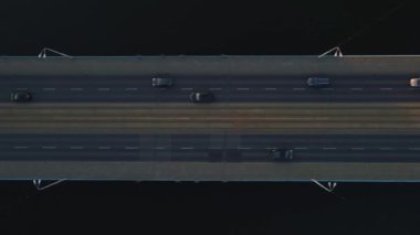 Top view of bridge over river with moving cars, Car trffic in city