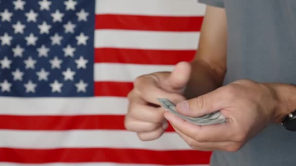 Male Hands Counting 100 Usd Banknotes Agains American Flag Unrecognizable — Vídeos de Stock