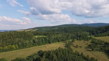 Aerial view of countryside area vith agricultural fields around mountains peaks background on summer day, Beautiful nature landscape in Poland