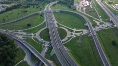 Aerial view of cars driving on round intersection in city, Transportation roundabout infrastructure, Highway road junction in Wroclaw, Poland