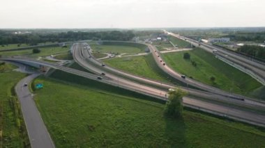 Aerial view of cars driving on round intersection in city, Transportation roundabout infrastructure, Highway road junction in Wroclaw, Poland