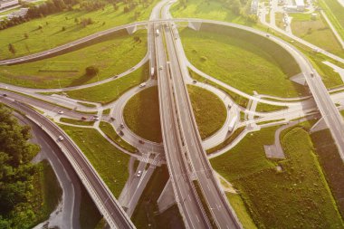 Aerial view of cars driving on round intersection in city, Transportation roundabout infrastructure, Highway road junction in Wroclaw, Poland