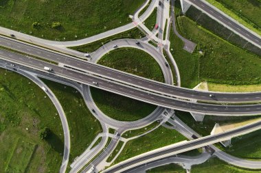Top view of cars driving on round intersection in city, Transportation roundabout infrastructure, Highway road junction in Wroclaw, Poland
