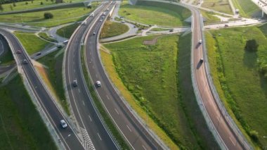 Aerial view of cars driving on round intersection in city, Transportation roundabout infrastructure, Highway road junction in Wroclaw, Poland