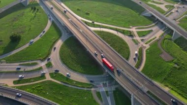 Aerial view of cars driving on round intersection in city, Transportation roundabout infrastructure, Highway road junction in Wroclaw, Poland