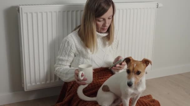 Worried Sad Woman Her Dog Sits Blanket Heating Radiator Use — Stock videók