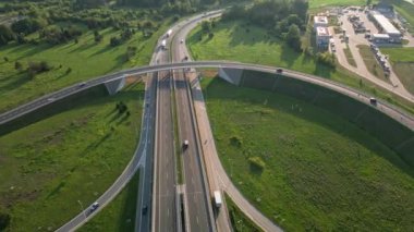Aerial view of cars driving on round intersection in city, Transportation roundabout infrastructure, Highway road junction in Wroclaw, Poland