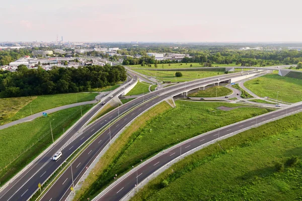 Aerial view of cars driving on round intersection in city, Transportation roundabout infrastructure, Highway road junction in Wroclaw, Poland