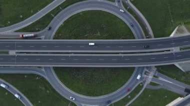 Top view of cars driving on round intersection in city, Transportation roundabout infrastructure, Highway road junction in Wroclaw, Poland