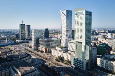 Aerial drone view of Warsaw cityscape, Center of Warsaw city with skyscrapers, Capital of Poland with modern office buildings in business center. Warsaw, Poland - September 4, 2022