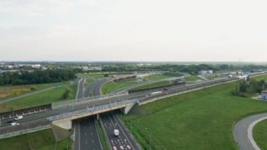 Aerial view of cars driving on round intersection in city, Transportation roundabout infrastructure, Highway road junction in Wroclaw, Poland